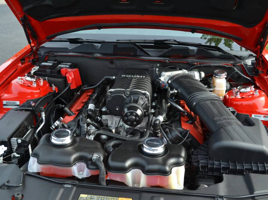 Professionally detailed and clean car engine bay by Twins Detailing Orlando, free of grease and grime