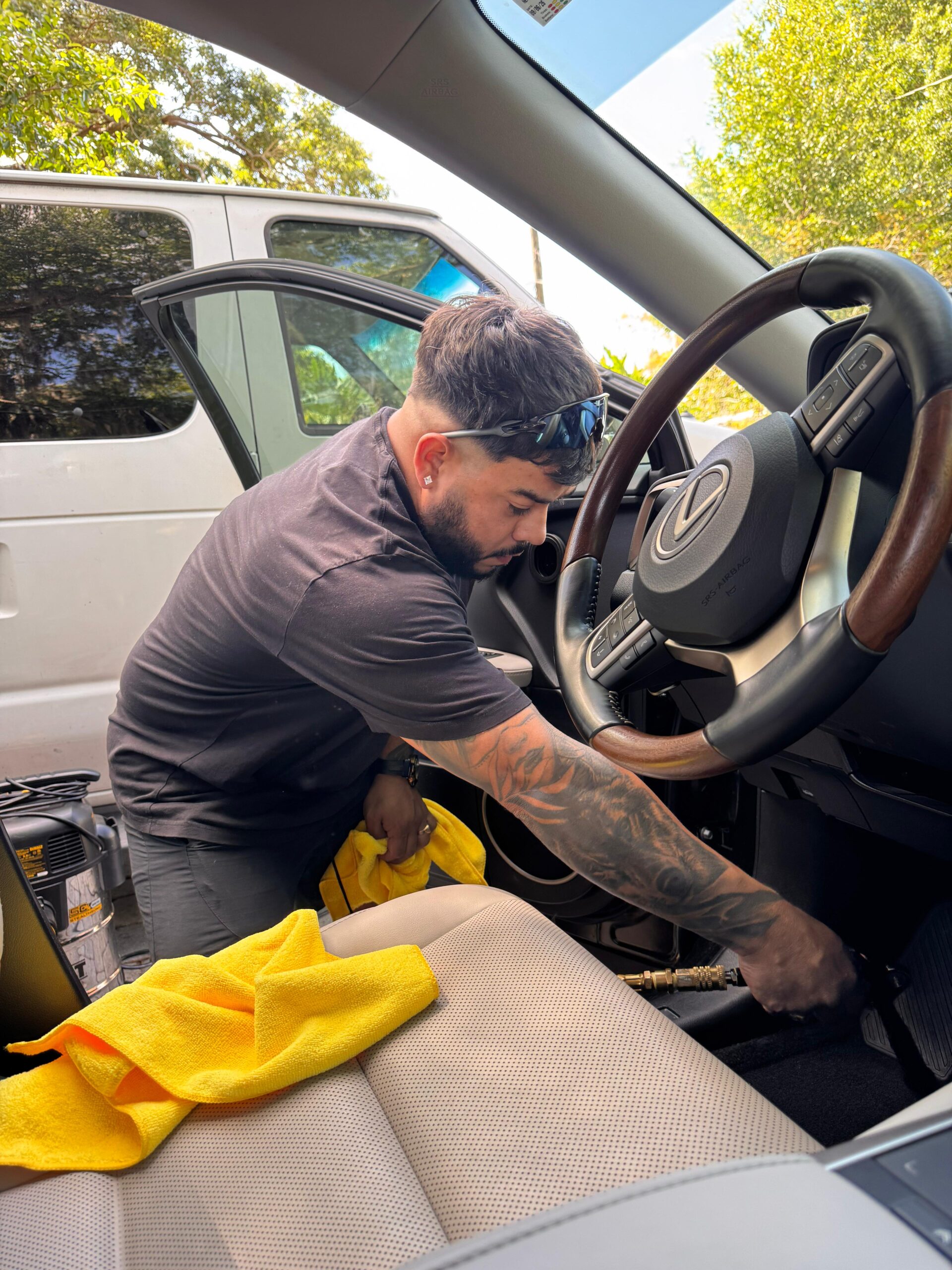 Rafael Tonitto — co-founder of Twins Detailing Orlando, working on vehicle interior